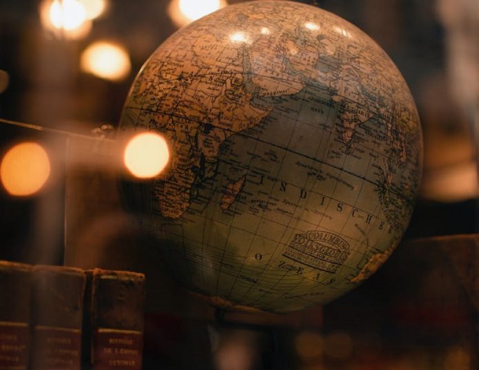 history books and globe pexels-photo-3837494